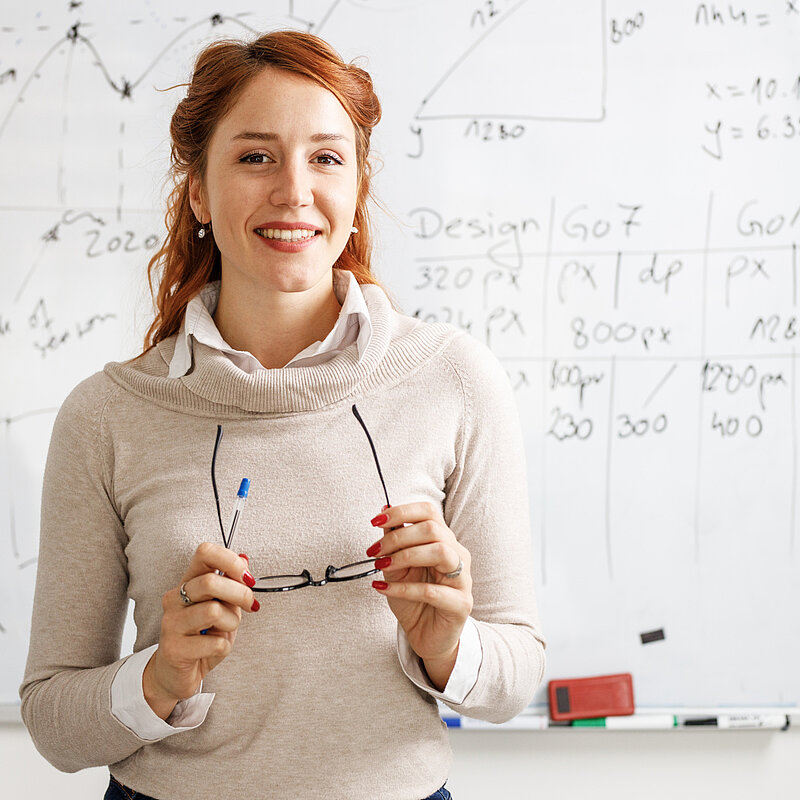 Smiling female professor giving a lesson about science facts of the HVAC world